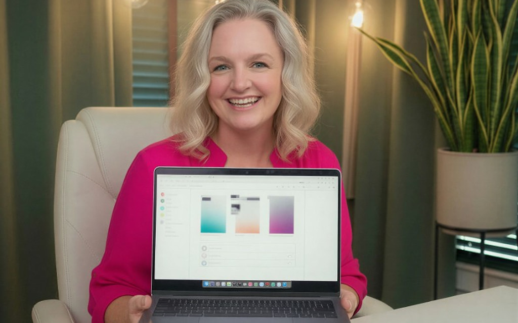 Karrie Christen presenting a custom AI app build on a laptop for small business owners